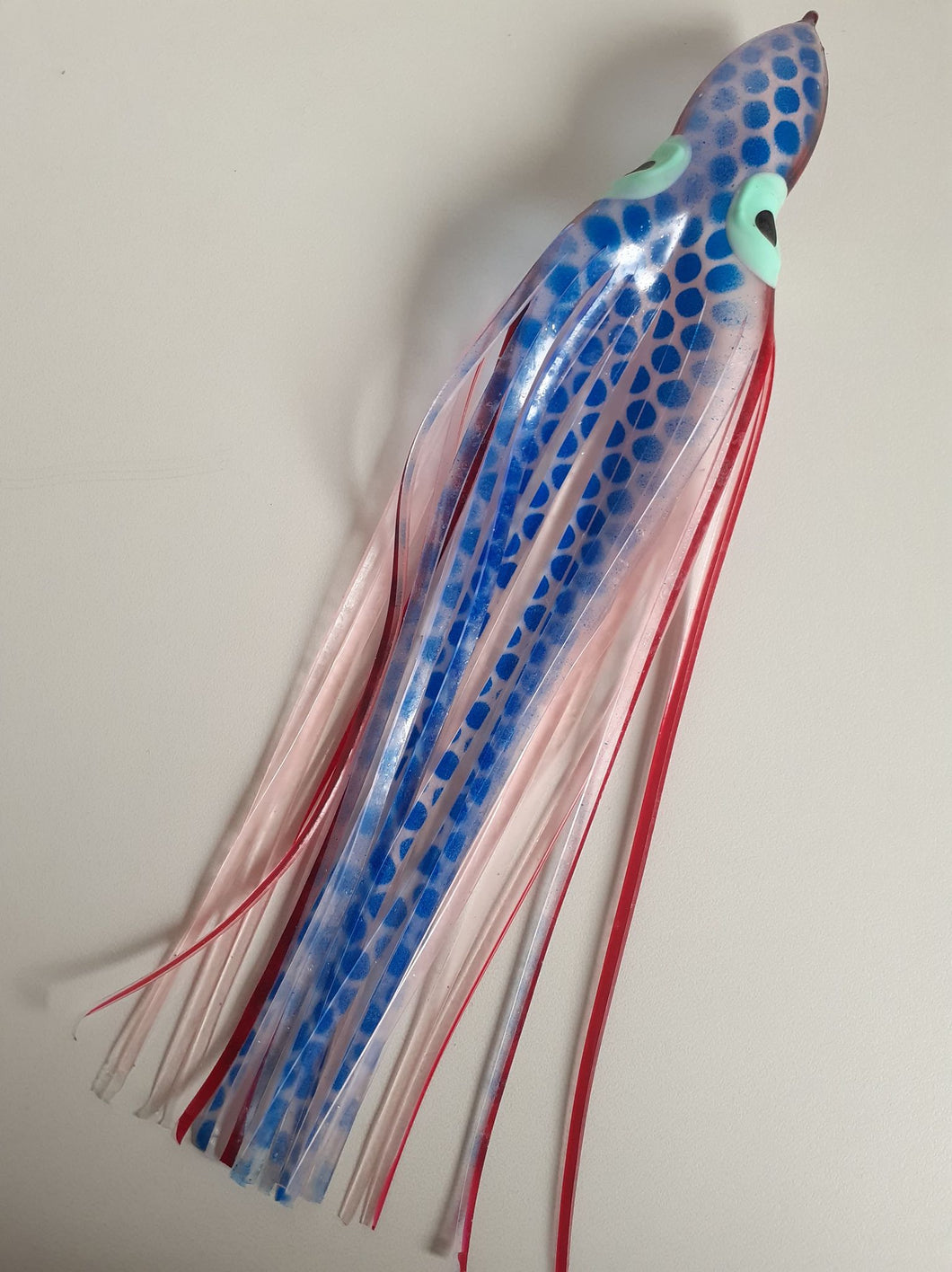 Yozuri octopus with eyes, blue dotted with red and white stripes, 9 1/2